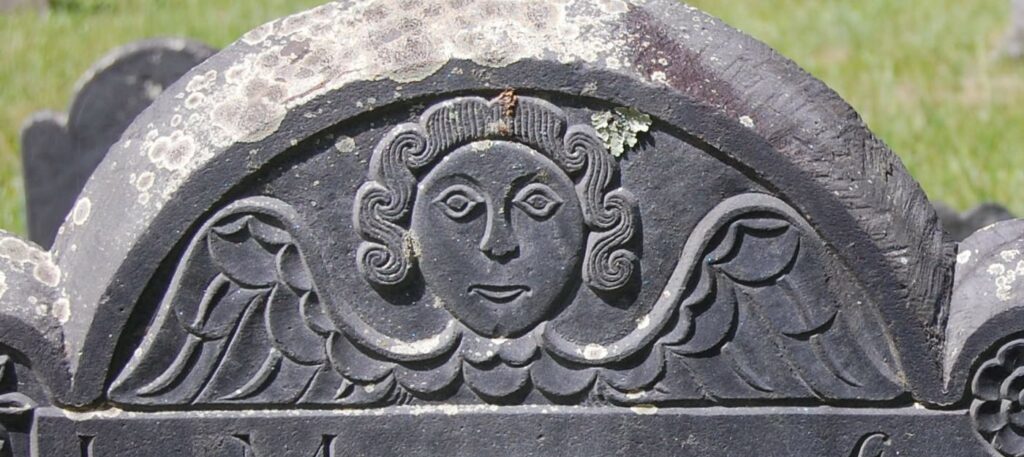 A cherub or winged face